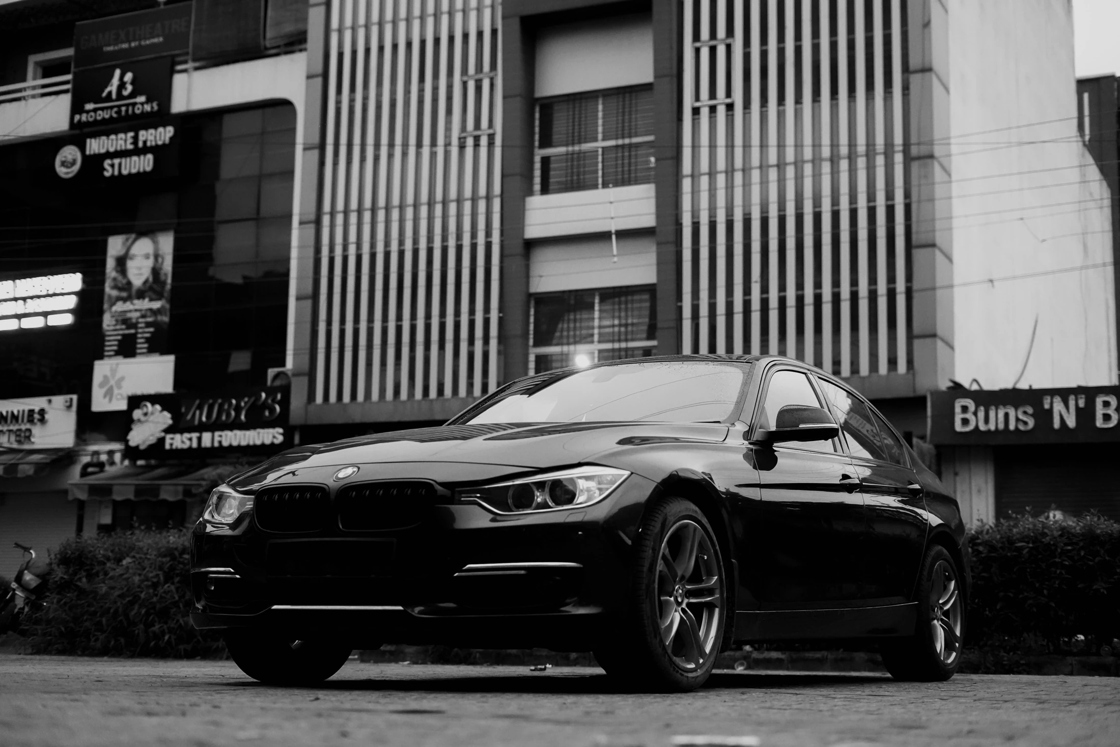 Black-and-white photograph of the BMW front and side