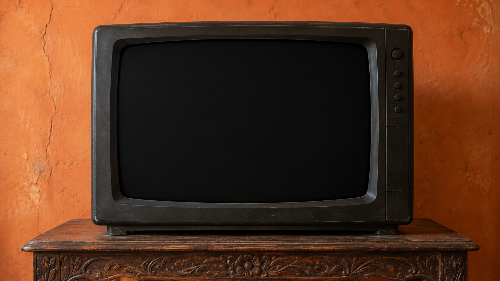 The film returns to the television in an orange room.